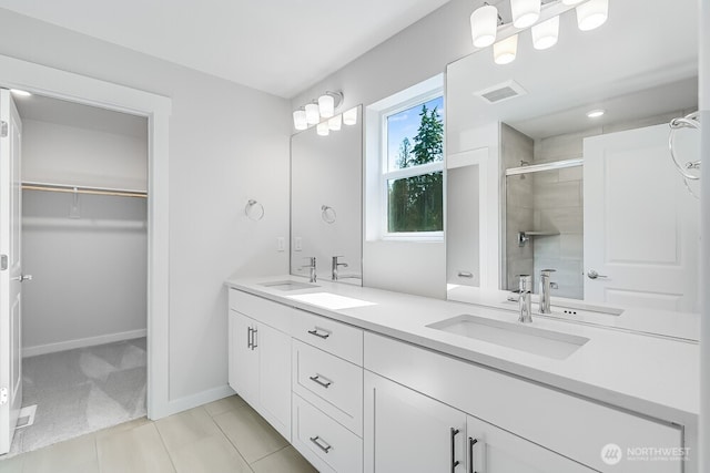 3313 SE 12th Ave, Battle Ground, WA 98604 - bathroom with a shower stall, double vanity, a walk in closet, and tile patterned flooring