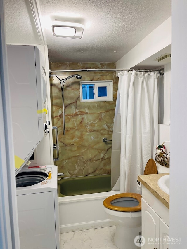 3411 180th Pl Unit 62, Seatac, WA 98188 - full bath with stacked washer and clothes dryer, shower / bath combo, vanity, marble finish flooring, and toilet