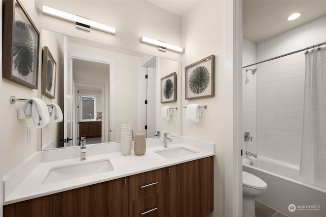 full bathroom featuring tile patterned flooring, vanity, toilet, and shower / tub combo