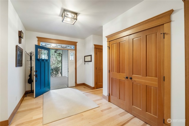 foyer with light wood-type flooring