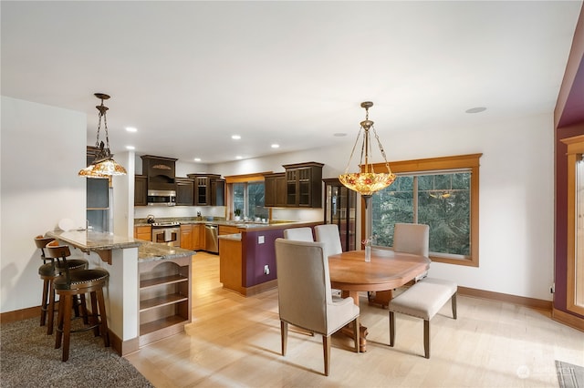 dining room featuring light hardwood / wood-style flooring