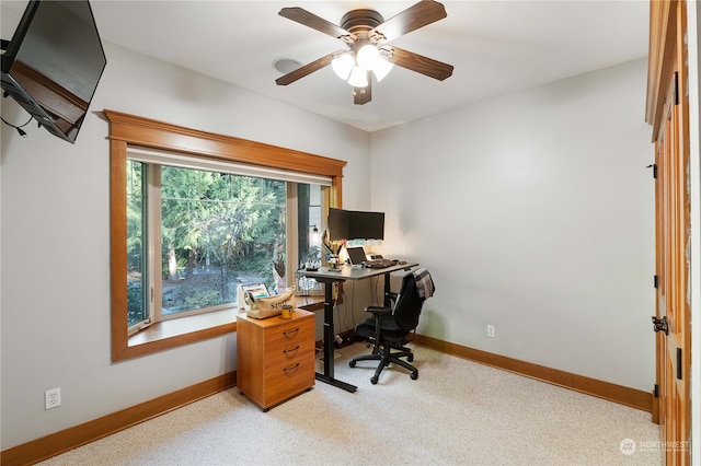 home office featuring light colored carpet and ceiling fan