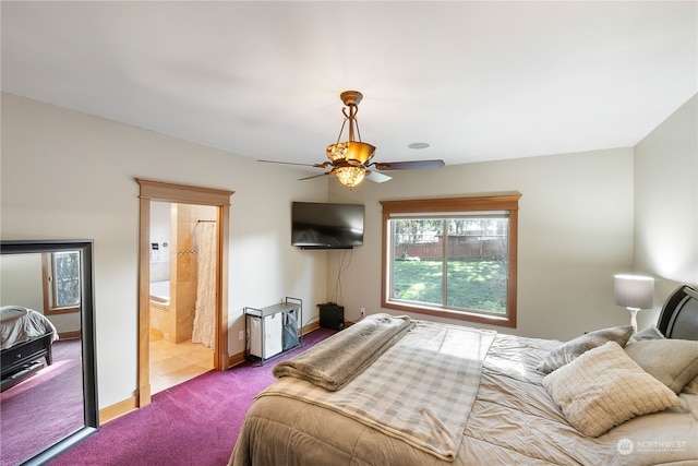 bedroom featuring carpet, ensuite bathroom, and ceiling fan