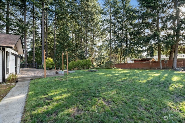 view of yard with a wooden deck