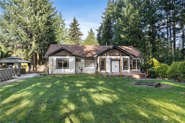 view of front of home with a gazebo and a front lawn