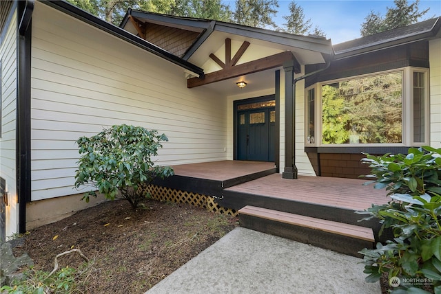 property entrance featuring a wooden deck