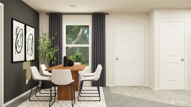 dining space featuring light hardwood / wood-style floors