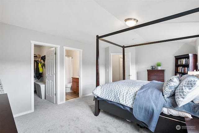 carpeted bedroom with ensuite bath