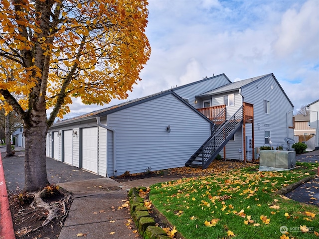 rear view of house with a garage