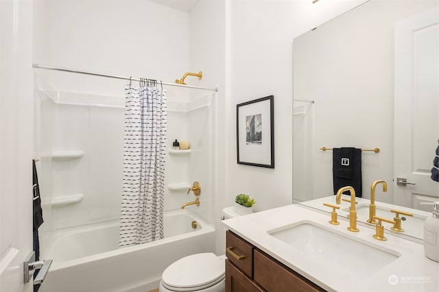 full bathroom with shower / tub combo with curtain, vanity, and toilet