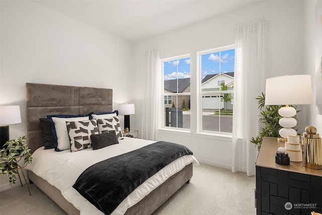 bedroom featuring light colored carpet