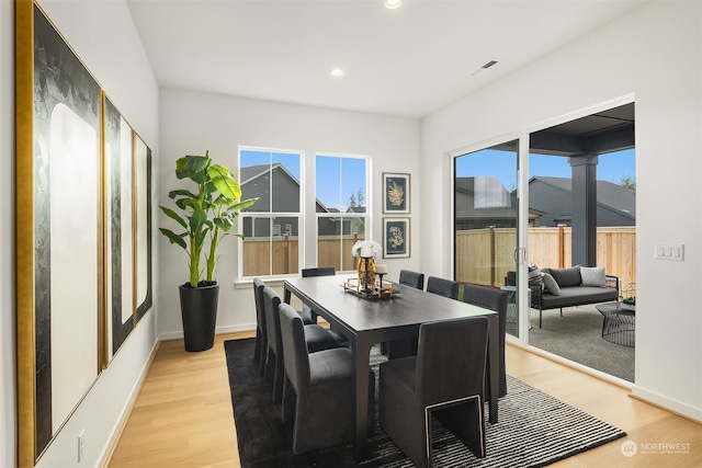 dining area with light hardwood / wood-style flooring