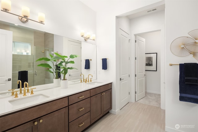 bathroom with vanity and walk in shower