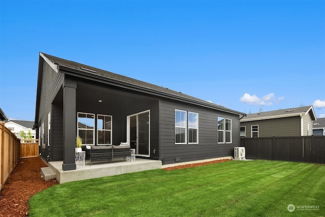 rear view of house with a yard, a patio, and an outdoor living space