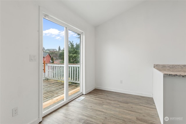 unfurnished dining area with hardwood / wood-style floors