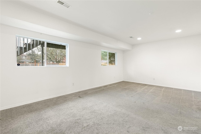 unfurnished room featuring carpet flooring