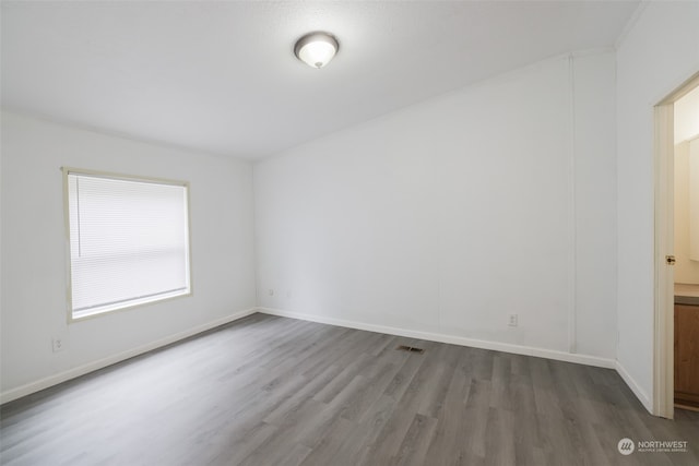 spare room featuring hardwood / wood-style flooring