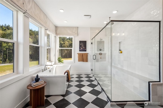 13730 SE 84th St Unit 13, Newcastle, WA 98059 - full bathroom featuring baseboards, a freestanding bath, a stall shower, recessed lighting, and tile patterned floors