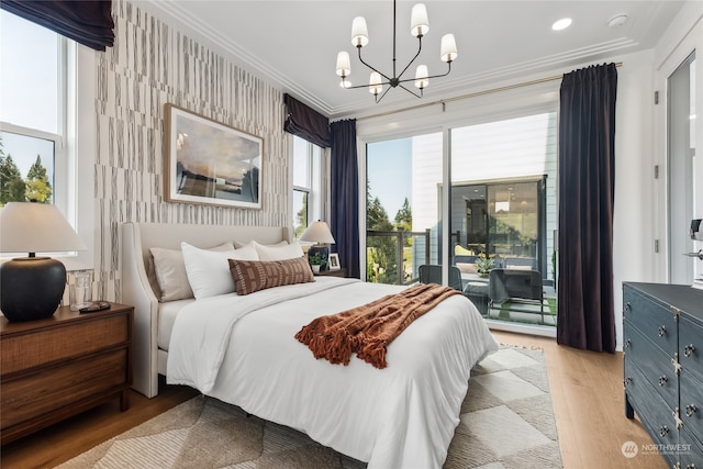 bedroom featuring access to outside, light hardwood / wood-style flooring, a chandelier, and ornamental molding