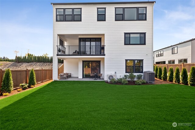 back of house with a yard, a balcony, central AC, and a patio area