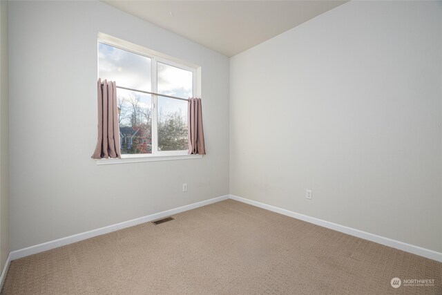 view of carpeted spare room