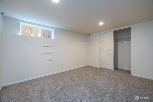 unfurnished bedroom with carpet and a closet