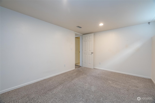 empty room with carpet flooring