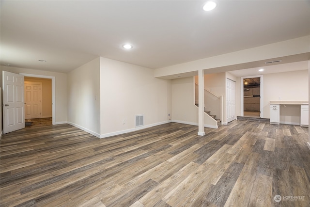 basement featuring dark hardwood / wood-style floors