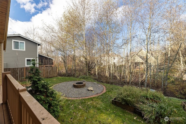 view of yard with a fire pit and a sunroom