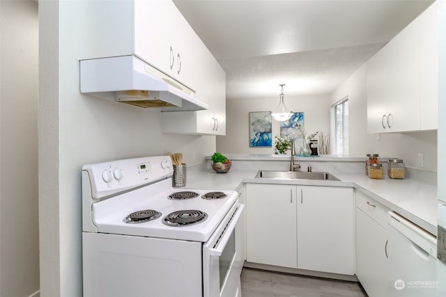 kitchen featuring white cabinetry, sink, kitchen peninsula, decorative light fixtures, and white appliances