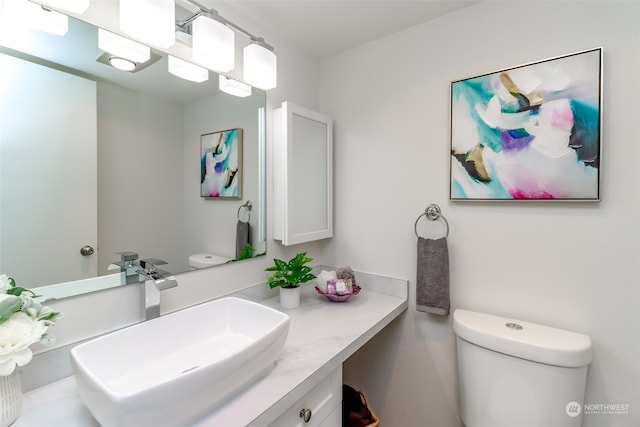 bathroom with vanity and toilet