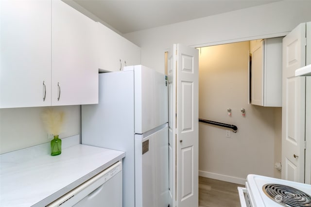 kitchen featuring white cabinetry, white appliances, and light wood-type flooring