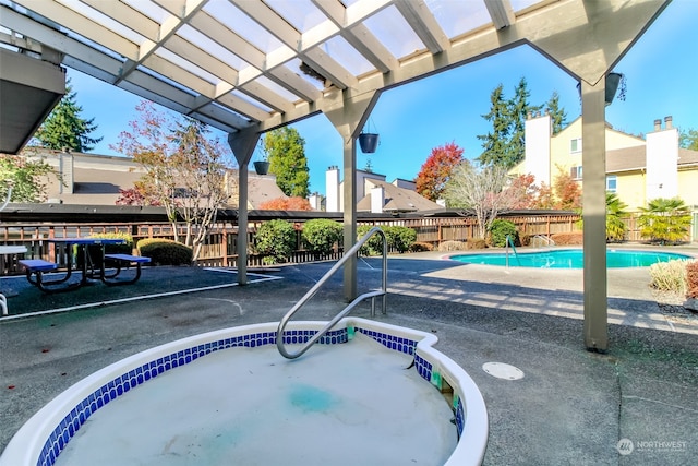 view of pool with an in ground hot tub, a pergola, and a patio area