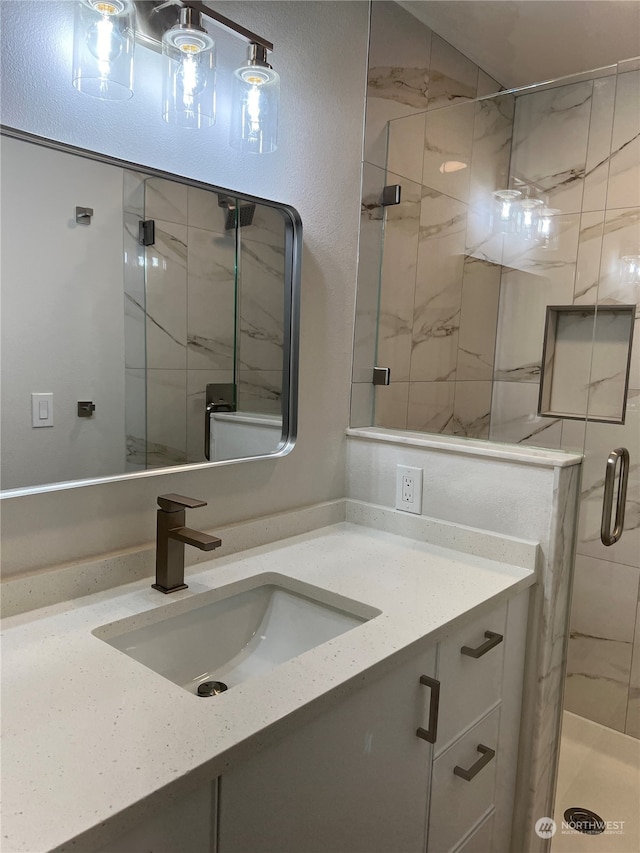 bathroom with vanity and an enclosed shower