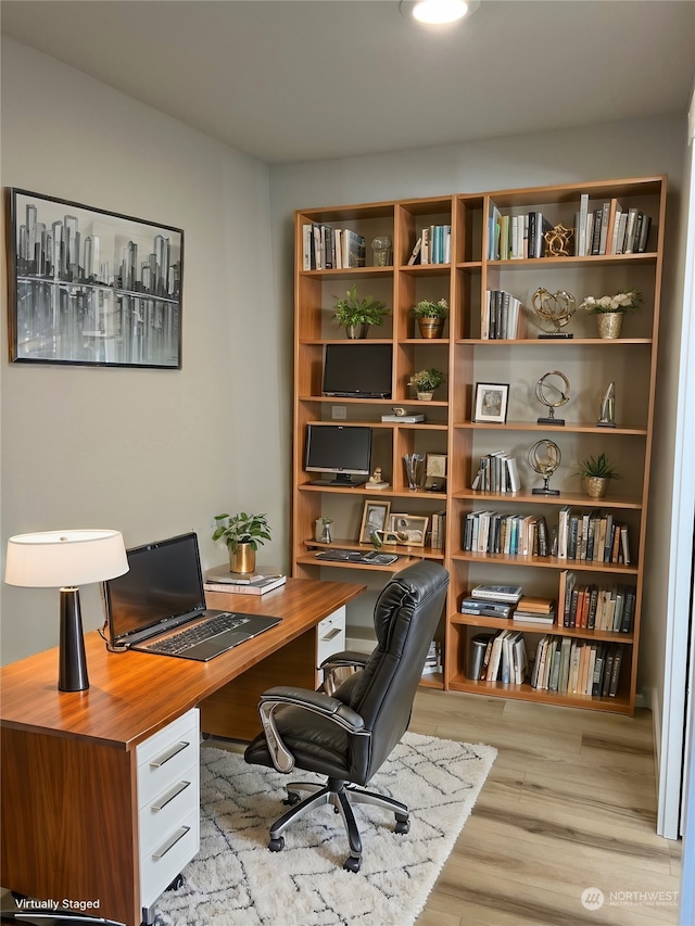 office area with light hardwood / wood-style flooring