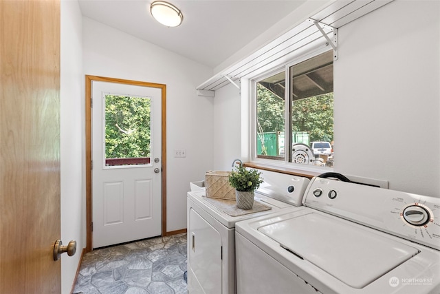 washroom with washing machine and clothes dryer