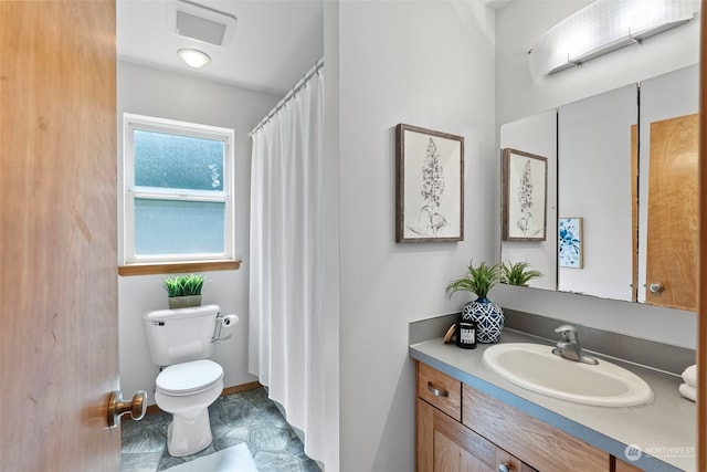 bathroom with vanity and toilet