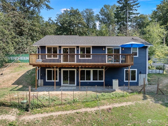 back of house featuring a deck