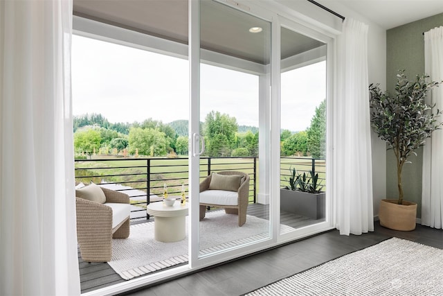 doorway to outside with dark hardwood / wood-style flooring