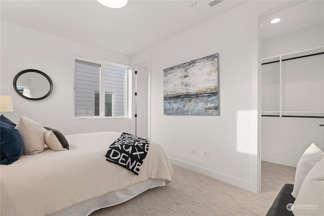 carpeted bedroom with a closet