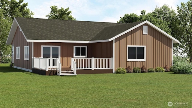 view of front of property with a front yard and roof with shingles