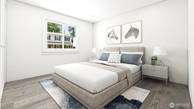 bedroom featuring baseboards and wood finished floors