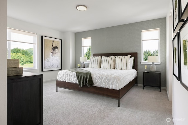 bedroom featuring multiple windows and light carpet