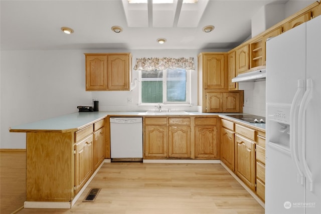 1100 S Rosewood Dr Unit 405, Ellensburg, WA 98926 - kitchen with white appliances, a peninsula, a sink, under cabinet range hood, and light wood-style floors