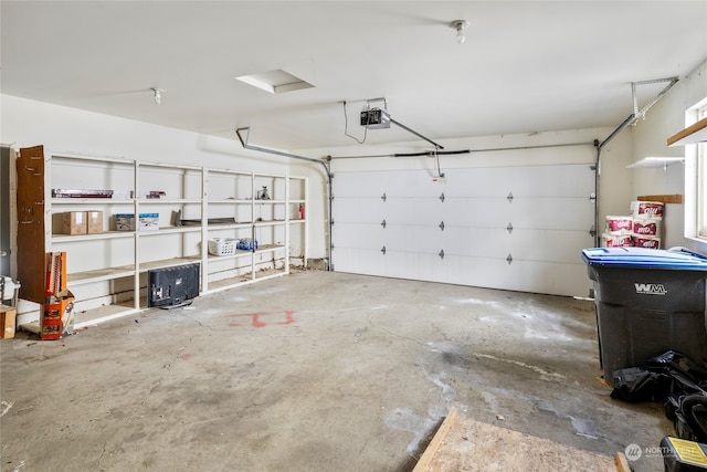 garage featuring a garage door opener