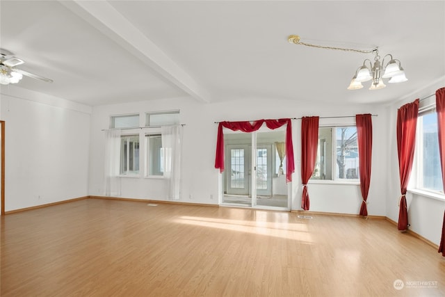 1100 S Rosewood Dr Unit 405, Ellensburg, WA 98926 - unfurnished living room with a chandelier, wood finished floors, ceiling fan, baseboards, and beam ceiling