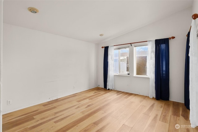1100 S Rosewood Dr Unit 405, Ellensburg, WA 98926 - unfurnished room featuring vaulted ceiling and light wood-style flooring