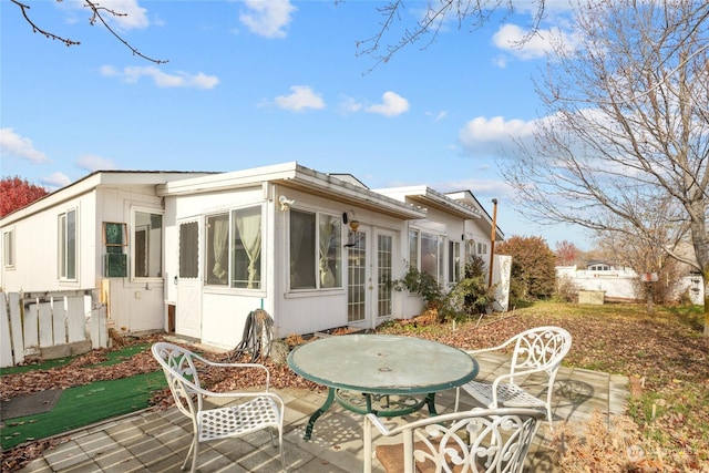 1100 S Rosewood Dr Unit 405, Ellensburg, WA 98926 - back of property featuring french doors, a patio area, fence, and a sunroom