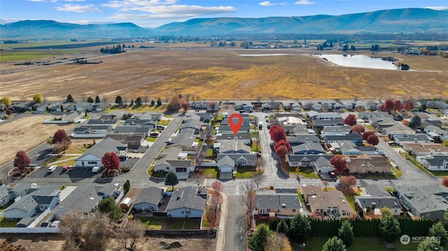 bird's eye view featuring a water and mountain view