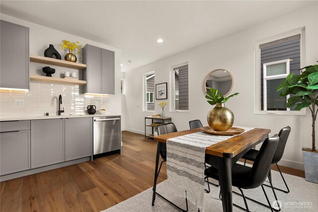 dining area with dark wood-style floors, baseboards, and recessed lighting